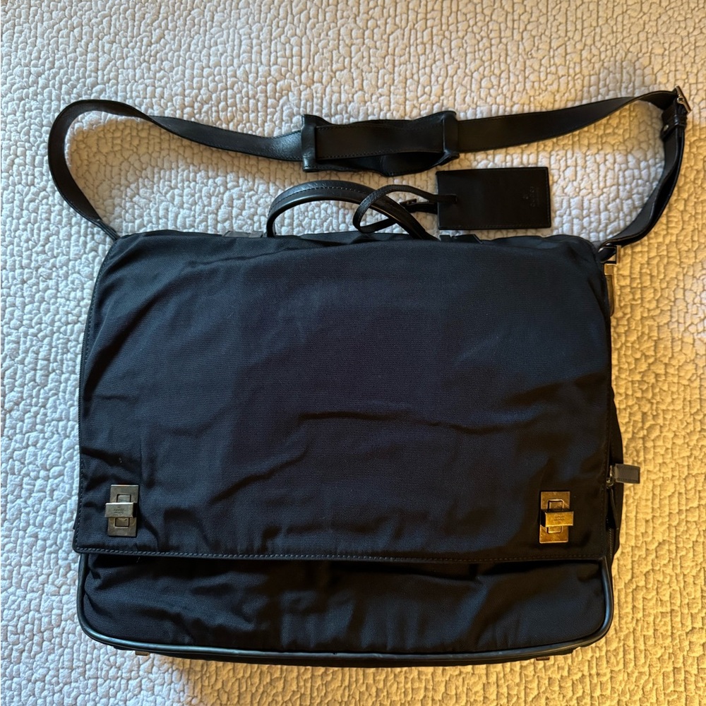 Gucci Briefcase. Black canvas/leather trim. Gunmetal hardware. Many compartments